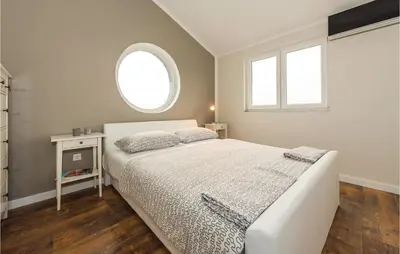 Krevet ili kreveti u jedinici u objektu Four-Bedroom Holiday Home In Skradin-Dubavice