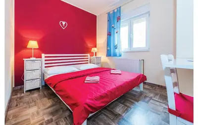 Krevet ili kreveti u jedinici u objektu Three-Bedroom Holiday Home In Dubrava