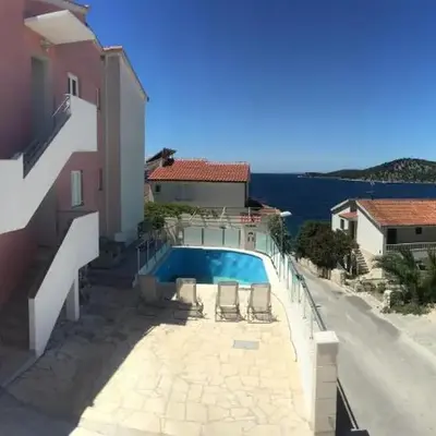 Family-friendly apartments with swimming pool Razanj