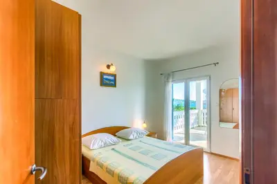 Krevet ili kreveti u jedinici u objektu Apartmani Vukičević