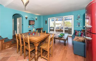 TV i/ili zabavni centar u objektu Three-Bedroom Holiday Home In Zaboric