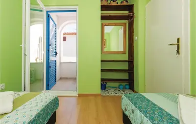 Krevet ili kreveti u jedinici u objektu Three-Bedroom Holiday Home In Zaboric