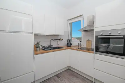 Kuhinja ili čajna kuhinja u objektu Dandy apartment with pool 2 bedrooms
