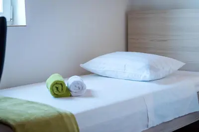 Krevet ili kreveti u jedinici u objektu Guesthouse Miranda NP Krka