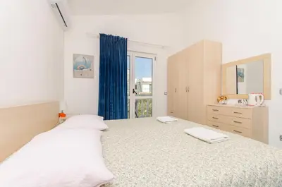 Krevet ili kreveti u jedinici u objektu Apartment and Rooms Radojka