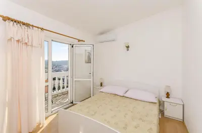 Krevet ili kreveti u jedinici u objektu Apartment and Rooms Radojka