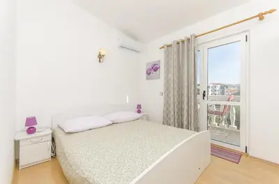 Krevet ili kreveti u jedinici u objektu Apartment and Rooms Radojka