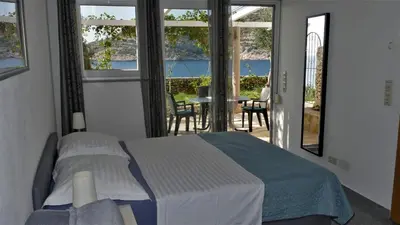Krevet ili kreveti u jedinici u objektu Direkt am Meer-Apartments Puntaplanka