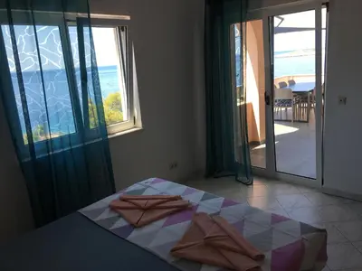 Krevet ili kreveti u jedinici u objektu Direkt am Meer-Apartments Puntaplanka