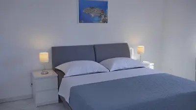 Krevet ili kreveti u jedinici u objektu Direkt am Meer-Apartments Puntaplanka