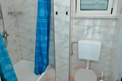 Kupaonica u objektu Direkt am Meer-Apartments Puntaplanka