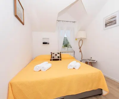 Krevet ili kreveti u jedinici u objektu Mediterranean terrace apartment with Bikes & SUP