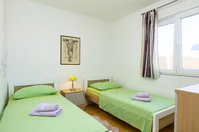 Krevet ili kreveti u jedinici u objektu Apartments by the sea Pirovac, Sibenik - 15659