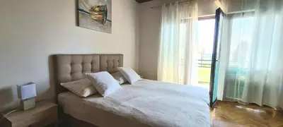 Krevet ili kreveti u jedinici u objektu Adriatica Apartments