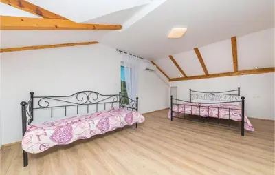 Krevet ili kreveti u jedinici u objektu Two-Bedroom Holiday Home In Ljubitovica
