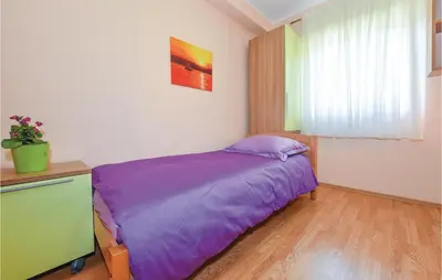 Krevet ili kreveti u jedinici u objektu Three-Bedroom Holiday Home In Sibenik