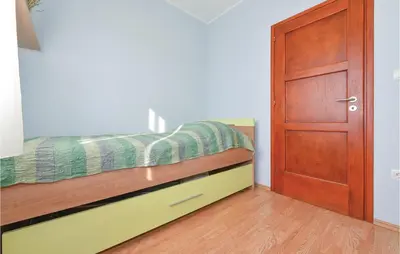 Krevet ili kreveti u jedinici u objektu Three-Bedroom Holiday Home In Sibenik