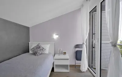 Krevet ili kreveti u jedinici u objektu Four-Bedroom Holiday Home In Rogoznica