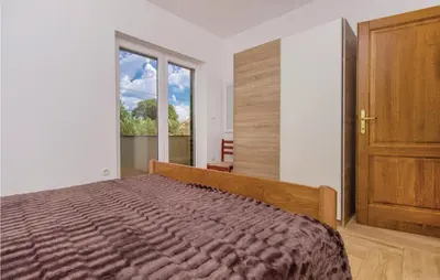Krevet ili kreveti u jedinici u objektu Four-Bedroom Holiday Home In Miljevci