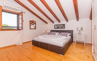 Krevet ili kreveti u jedinici u objektu Three-Bedroom Holiday Home In Lozovac