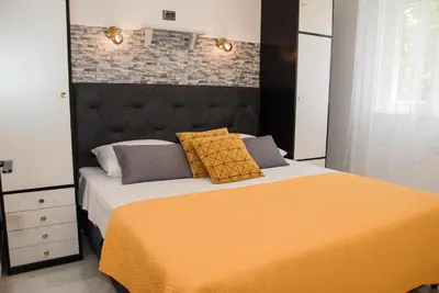 Krevet ili kreveti u jedinici u objektu Beachfront Apartment Nikol