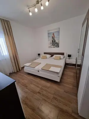 Krevet ili kreveti u jedinici u objektu APARTMAN SMOLJIC 4+2