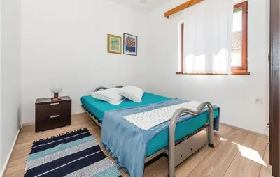 Krevet ili kreveti u jedinici u objektu Four-Bedroom Holiday Home In Zaboric