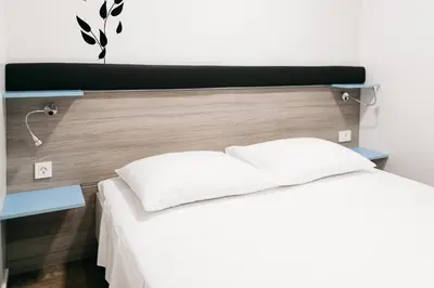 Krevet ili kreveti u jedinici u objektu Illyria Apartments