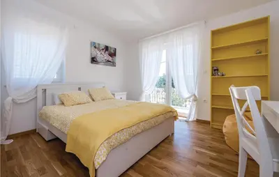 Krevet ili kreveti u jedinici u objektu Three-Bedroom Holiday Home In Pakovo Selo