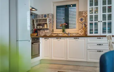 Kuhinja ili čajna kuhinja u objektu Three-Bedroom Holiday Home In Pakovo Selo