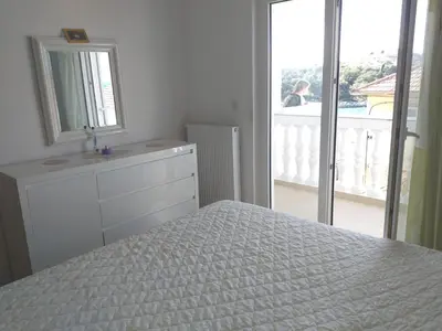 Krevet ili kreveti u jedinici u objektu Apartmani Ivan by the sea