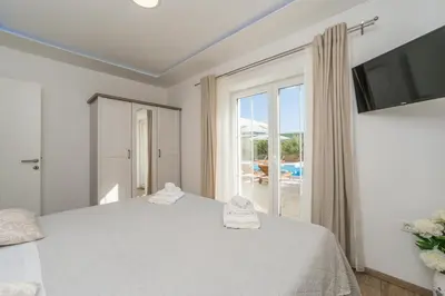 Krevet ili kreveti u jedinici u objektu Villa San Antonio - Heated pool