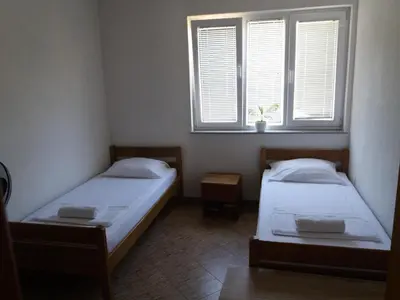 Krevet ili kreveti u jedinici u objektu 4 Bedroom Apartment in Tisno (8+4)
