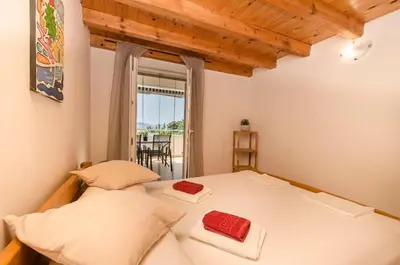 Krevet ili kreveti u jedinici u objektu Apartments Holiday near beach