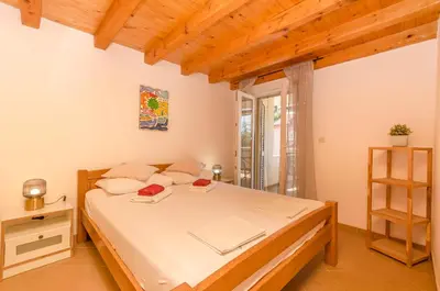 Krevet ili kreveti u jedinici u objektu Apartments Holiday near beach