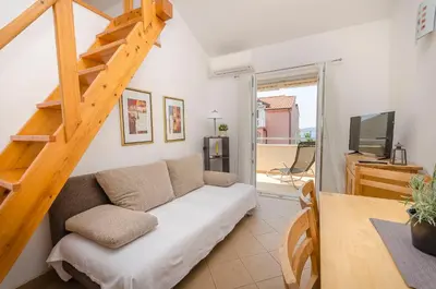 TV i/ili zabavni centar u objektu Apartments Holiday near beach