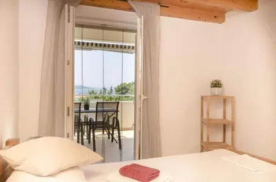 Krevet ili kreveti u jedinici u objektu Apartments Holiday near beach