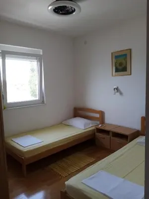 Krevet ili kreveti u jedinici u objektu APARTMAN ZVONIMIR