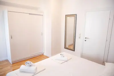 Krevet ili kreveti u jedinici u objektu Apartments and Rooms Plaza