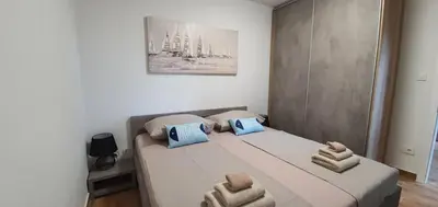 Krevet ili kreveti u jedinici u objektu Apartmani Tisno TM