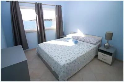 Krevet ili kreveti u jedinici u objektu Apartments Villa J i M by the sea