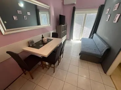 TV i/ili zabavni centar u objektu Beachfront Apartment Sun