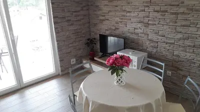 TV i/ili zabavni centar u objektu Seaview & Balcony Apartment PETRA