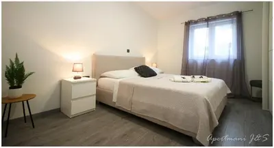 Krevet ili kreveti u jedinici u objektu Apartmani Jere&Sara