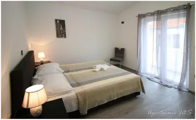 Krevet ili kreveti u jedinici u objektu Apartmani Jere&Sara