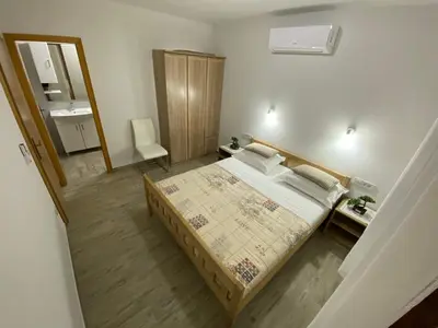 Krevet ili kreveti u jedinici u objektu Stone Holiday Homes Stankovci with pool and Mediterranean gardens