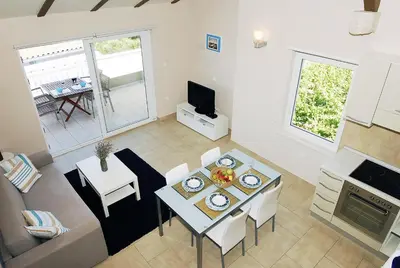 TV i/ili zabavni centar u objektu Apartments Maslina