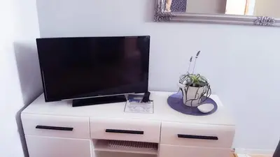 TV i/ili zabavni centar u objektu Apartments Jonjić