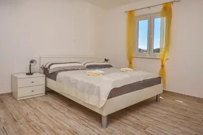 Krevet ili kreveti u jedinici u objektu Apartments Jelena