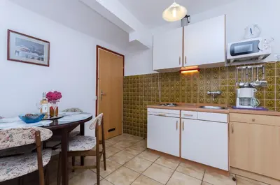Kuhinja ili čajna kuhinja u objektu Apartments Mirjana Blue Beach